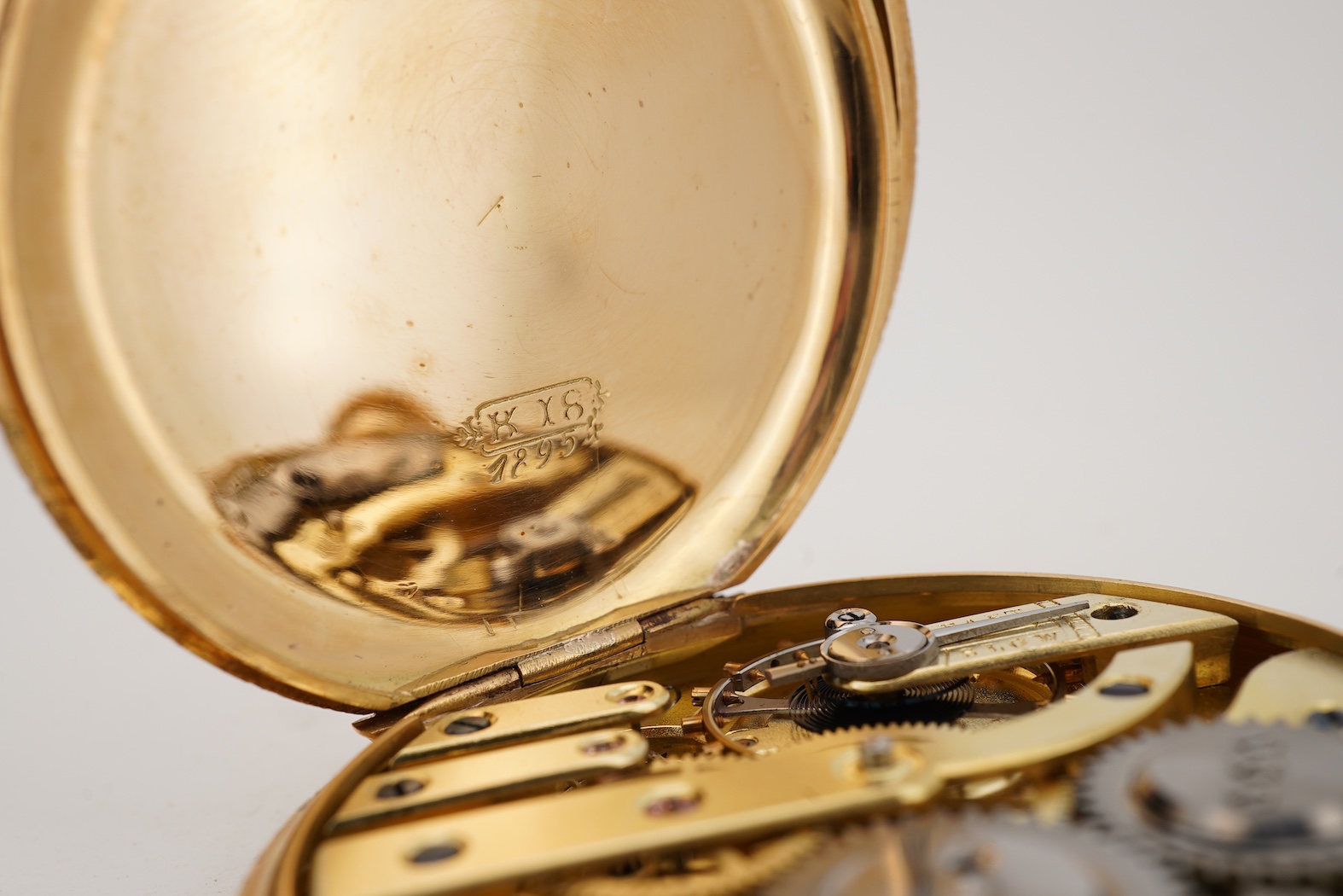 A lady's early 20th century Swiss engraved 18k open faced keyless fob watch